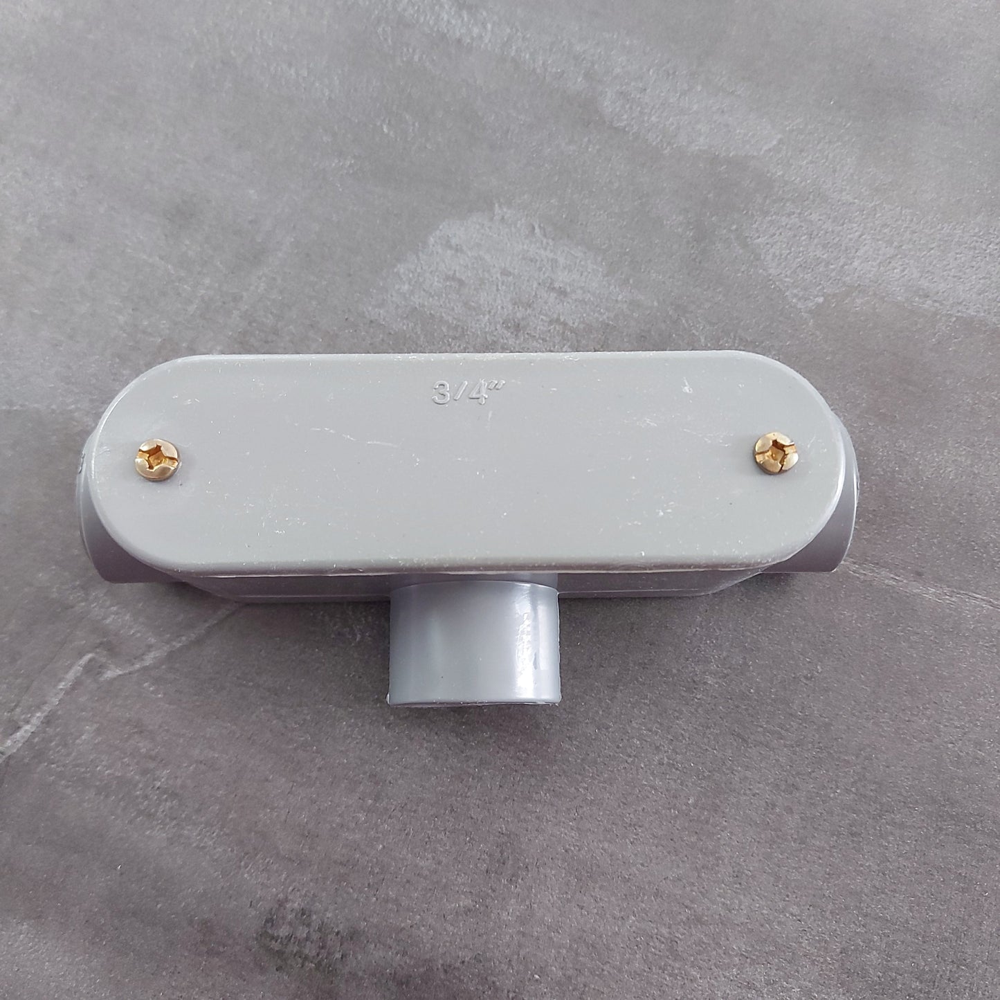 CONDULETO T 1'' PVC GRIS